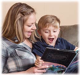 Adult and child reading together